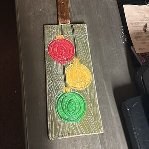 Festive Wooden Holiday Decor with Red, Yellow, and Green Ornaments